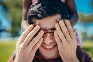 man covering his eyes