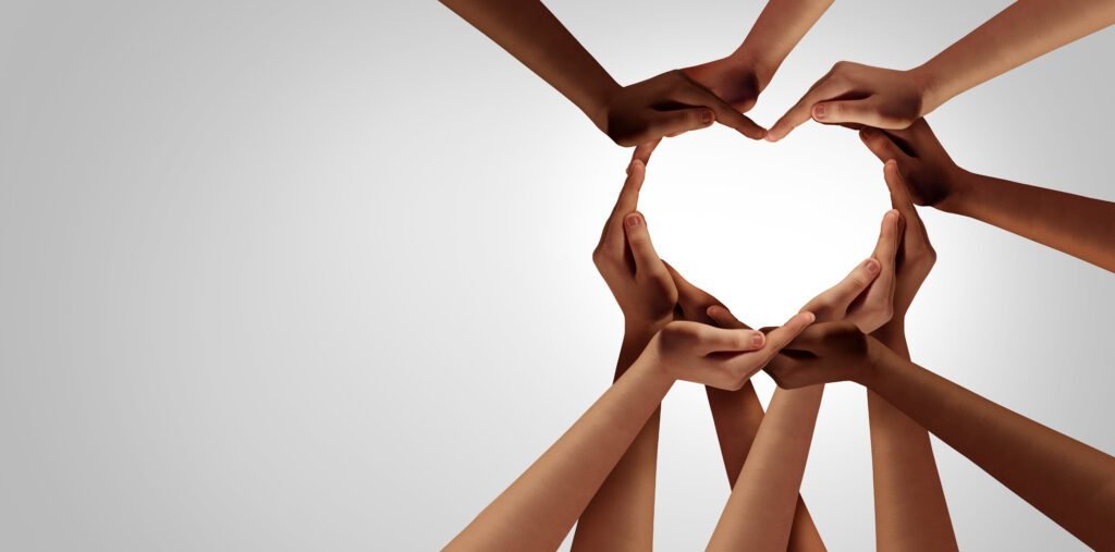 Image of several hands forming the shape of a heart, symbolizing the importance of genuine connection.