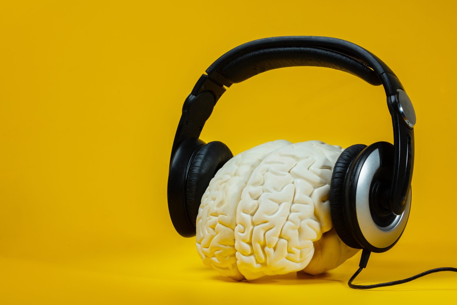 Image of headphones on a brain, symbolizing mindful listening.