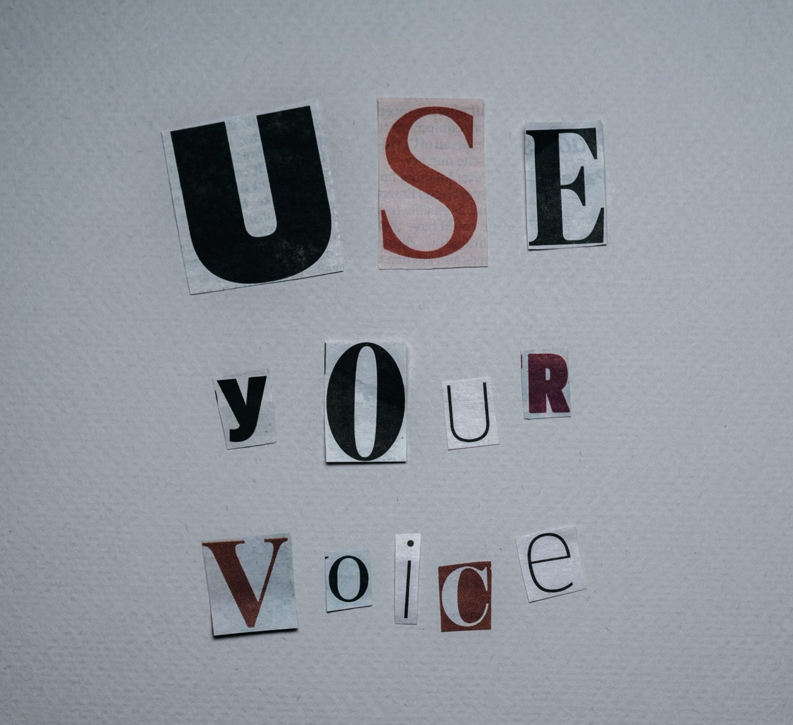 Image of magazine letter clippings that spell "use your voice".